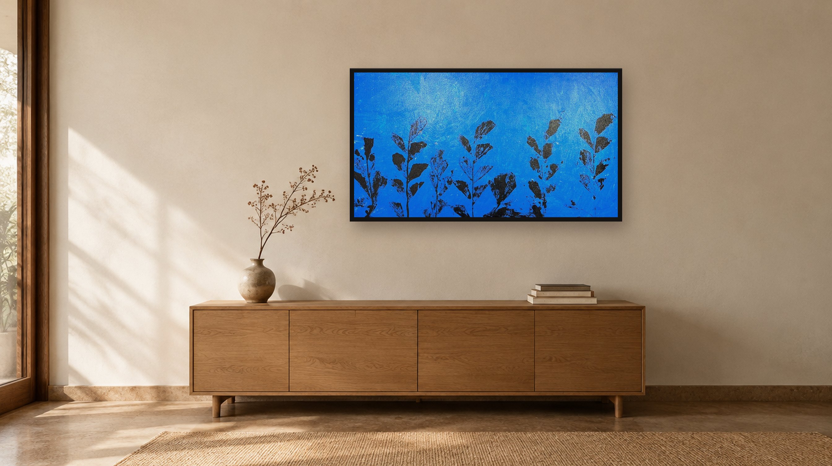Blue Leaves hanging above a wooden sideboard in a warm, sunlit room